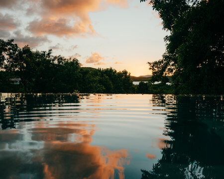 Sunset reflected in pool. Antigua, Caribbean