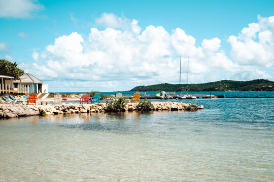 Cute colorful chairs by the beach on Nonsuch Bay, Antigua