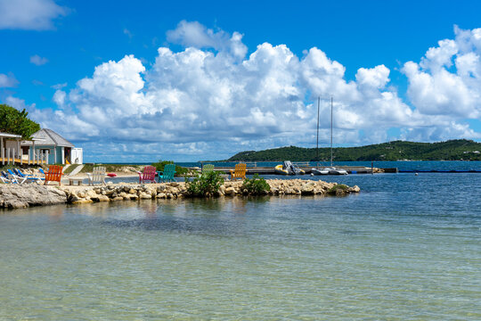 Cute colorful chairs by the beach on Nonsuch Bay, Antigua