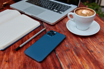 Top view of a freelancer workspace in a cafe