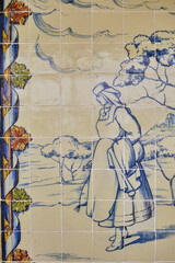 details of an azulejos panel representing monuments and country scenes on the walls of the station in Leiria, Portugal