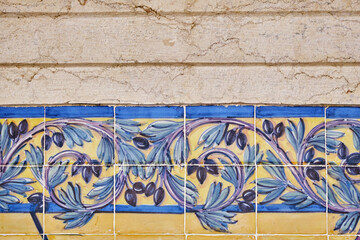 details of an azulejos panel representing monuments and country scenes on the walls of the station...