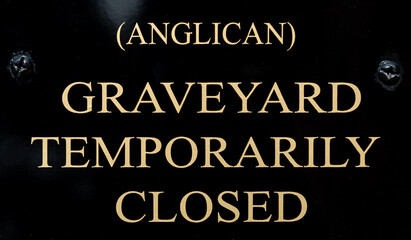 Sign reading Anglican Graveyard Temporarily Closed