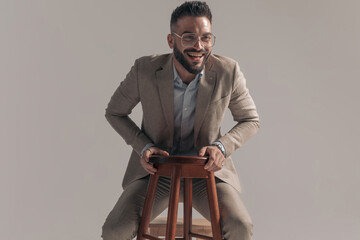 happy businessman standing in a squatting position