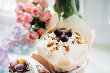 Beautiful Easter cakes with Easter eggs on a decorated light table. Bright Easter holiday.