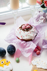 Beautiful Easter cakes with Easter eggs on a decorated light table. Bright Easter holiday.