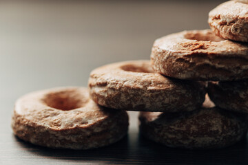 Beautiful Bagels and Gingerbreads Lie on a Brown Background