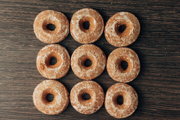 Beautiful Bagels and Gingerbreads Lie on a Brown Background