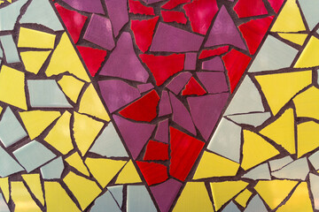 Fototapeta na wymiar Background from real triangular multicolored tiles