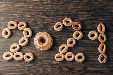 From Many bagels and gingerbread folded 2021 on a Brown Background
