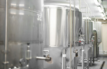 Modern brewery factory interior with reservoirs.