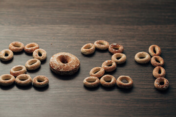 Number 2021 From Bagels And Gingerbread on a Brown Background
