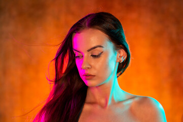 Portrait shot of a pretty young woman in RGB colors.