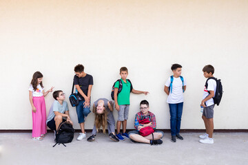 Group of elementary school kids having fun before classes. Back to school