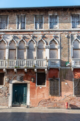 Facade of an old abandoned Palace in Venice