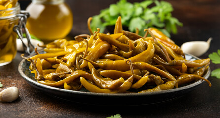 Homemade Pickled Green Chillies on plate. Healthy hot food
