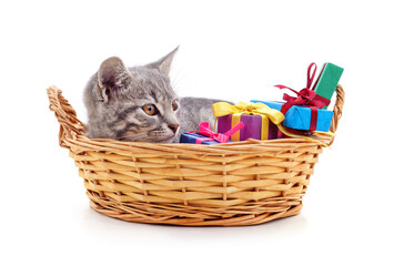 Fototapeta na wymiar Kitten in the basket and gifts.