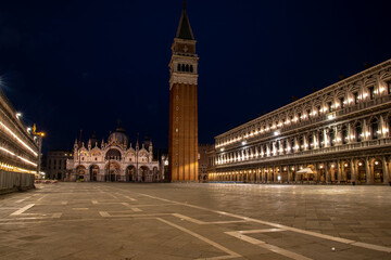 Empty St Marks Square and illuminated Basilica in the early Morning, Venice