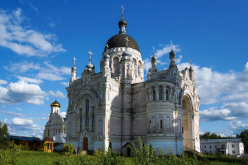 Fototapeta na wymiar Russia, Tver region, Vyshny Volochyok. Cathedral of the Kazan Icon of the Mother of God in orthodox women's Monastery. Architectural, historical and religious landmark. Summer, sunny day, blue sky
