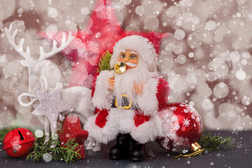 Santa, Christmas deer and festive decorations on table. Christmas still life web banner