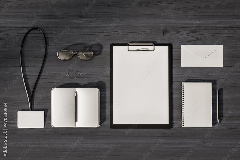 Poster top view and close up of empty office supplies on dark wooden desktop. clipboard, notepad, bad, enve