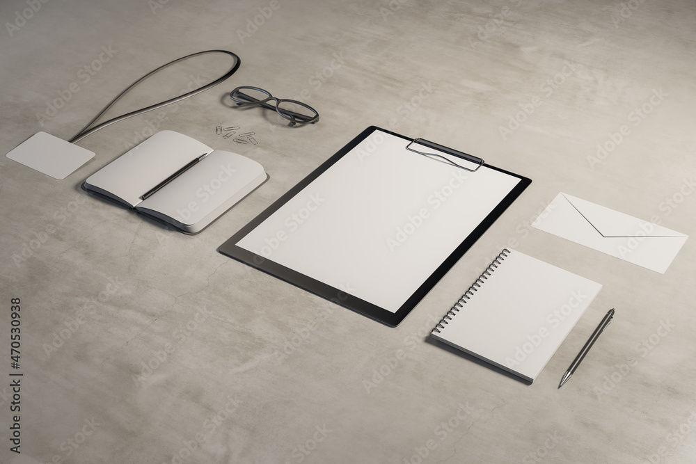 Poster top view and close up of empty office supplies on concrete desk. clipboard, notepad, bad, envelope. 