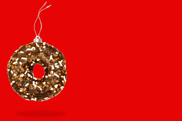 Christmas bauble ball decoration toy made of sweet sugar chocolate brown lazed doughnut donut...
