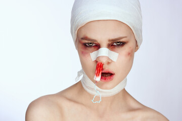 emotional woman tampon in the nose with blood injured face studio lifestyle