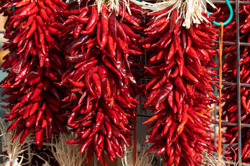 Fototapeta premium Dried red chilli pepers hanging at a New Mexico store