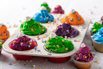 Unique multicolored cupcakes made of cream for fat thursday.