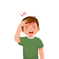 Little boy suffering from headache or migraine touching his forehead.