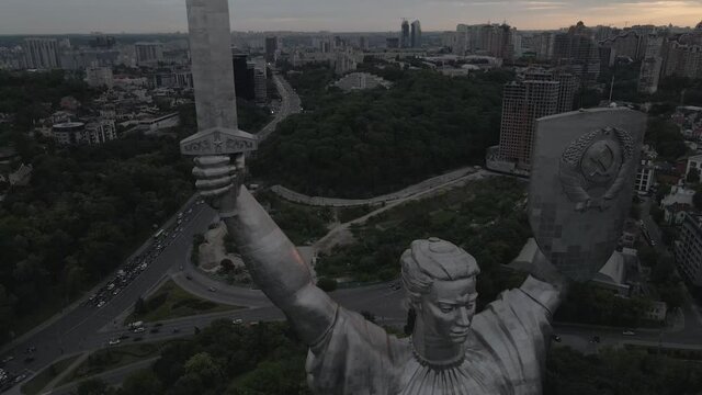 Landmark of Kyiv, massive monument of Motherland, cityscape, car traffic, 4k