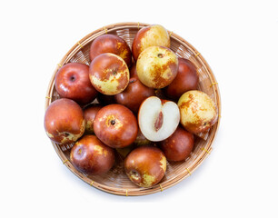 Fresh jujubes in Bamboo basket, Chocolate jujube on white background.