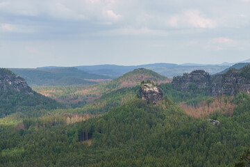 Fototapeta na wymiar View over rock formations, hills and forest of National Park Saxon Switzerland, Germany