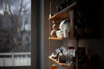 Items on the shelf in the kitchen. Things in the room.