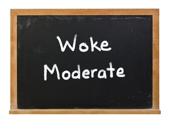 Obraz premium Woke moderate written in white chalk on a black chalkboard isolated on white