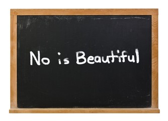 Embrace No, No is beautiful written in white chalk on a black chalkboard isolated on white