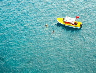 boat in the sea with divers