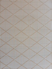 White-light brown fabric pattern woven into a beautiful diamond pattern, suitable for making background images.Fabric texture background. Texture of vintage seamless fabric pattern background.
