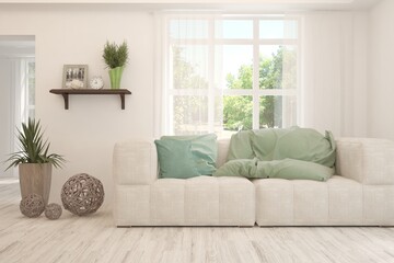 White living room with sofa and summer landscape in window. Scandinavian interior design. 3D illustration