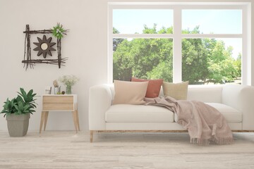 White living room with sofa and summer landscape in window. Scandinavian interior design. 3D illustration