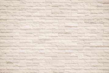 Fototapeta premium Cream and white brick wall texture background. Brickwork and stonework flooring interior backdrop
