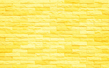 Brick wall painted with yellow paint pastel bright tone texture background. 