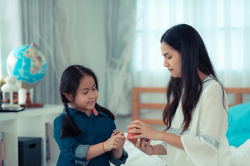 Asian woman Teenager in feeling of happy and smiling lifestyle while relax in living room at home