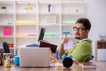 Young male designer working in the office