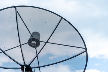 A Satellite dish on roof in blue sky with cloud Background