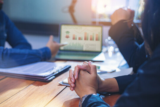 Business peoples meeting to analyze and discuss for situation on the marketing. Selected focus.