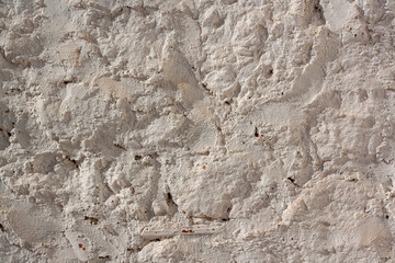 Formless wall covered with cement. Horizontal photo.