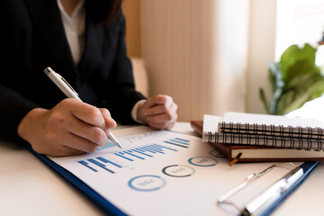 strategy analysis concept, Businessman working financial Manager Researching Process accounting calculate analyse market graph data stock information review on the table in office.