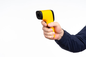 A man with portable thermometer. Man measures temperature. Thermometer for non-contact checking of...